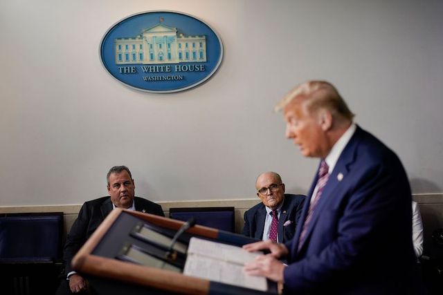 Former New Jersey Gov. Chris Christie, left, and Rudy Giuliani, center, an attorney for President Donald Trump, listing to President Donald Trump, left, during a news conference at the White House, in Washington